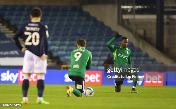 Rekeem Harper of Birmingham City takes a knee in support of the Black Lives Matter movement prior to the Sky Bet Championship match between Millwall...