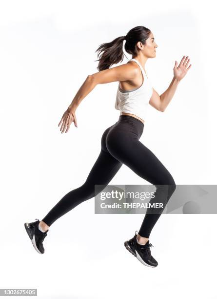 athletische hündin läuft auf weißem hintergrund - woman white background stock-fotos und bilder