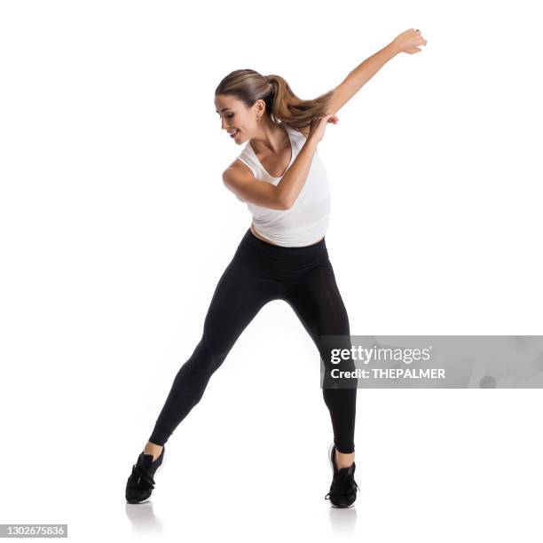 hispanic female practicing zumba moves - zumba stock pictures, royalty-free photos & images