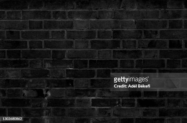 black brick wall - brick wall stock pictures, royalty-free photos & images