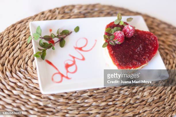 homemade heart-shaped cheese and raspberry cake - raspberry jam stock pictures, royalty-free photos & images