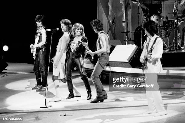 Members of British Rock group the Rolling Stones perform onstage, with special guest Tina Turner on vocals, during 'The Rolling Stones American Tour...