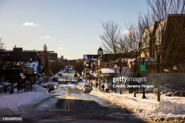 kirkwood avenue in bloomington, indiana after a snowstorm - bloomington indiana stock pictures, royalty-free photos & images