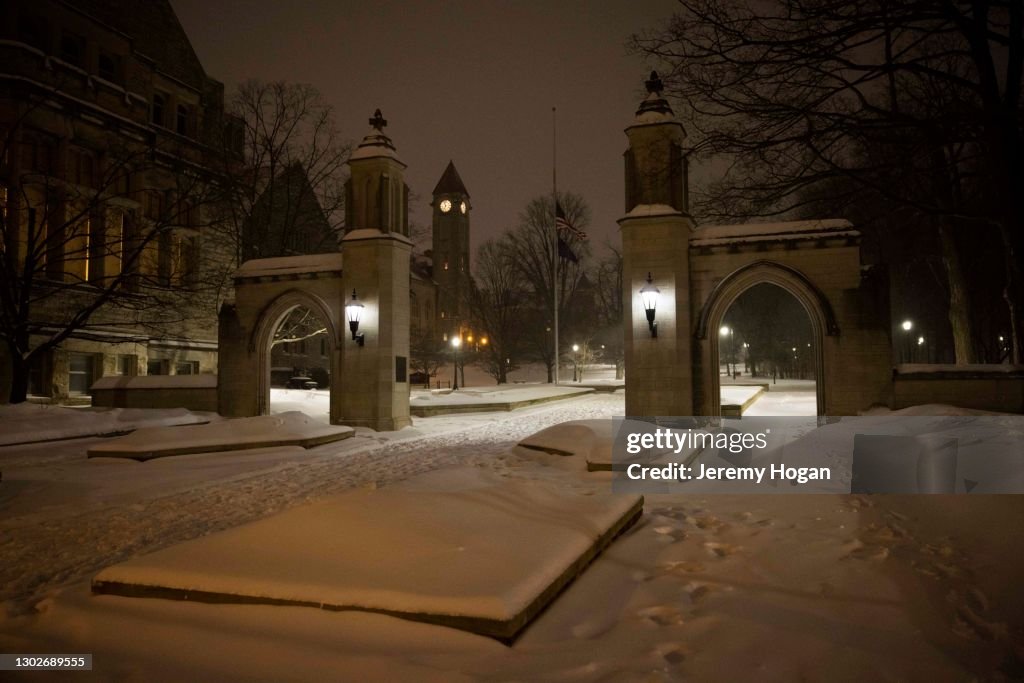 Snow covers the sidewalks at Indiana University"u2019s Sample Gates in Bloomington, Indiana