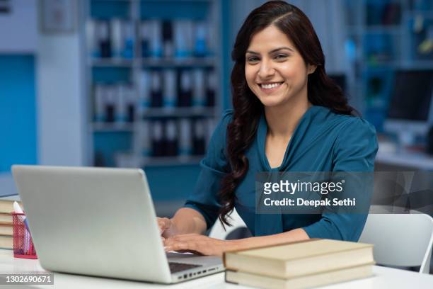 young business women working in office using laptop - stock photo - professional occupation stock pictures, royalty-free photos & images