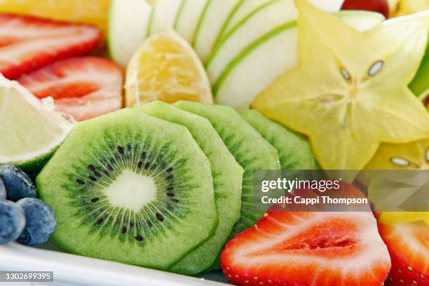 fuit salad with kiwi, strawberry, and star fruit - starfruit stock pictures, royalty-free photos & images