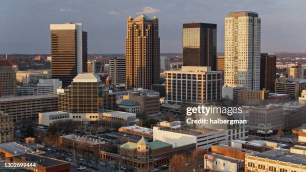 aerial shot of golden sunlight on birmingham, alabama at sunset - birmingham alabama stock pictures, royalty-free photos & images