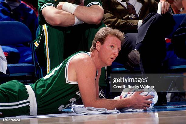 Larry Bird of the Boston Celtics stretches against the Sacramento Kings on March 12, 1991 at Arco Arena in Sacramento, California. NOTE TO USER: User...