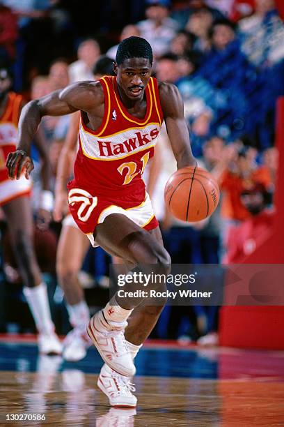 Dominique Wilkins of the Atlanta Hawks drives against the Sacramento Kings on November 30, 1986 at Arco Arena in Sacramento, California. NOTE TO...