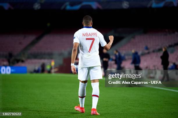 Kylian Mbappe of Paris Saint-Germain celebrates after scoring his team's first goal during the UEFA Champions League Round of 16 match between FC...