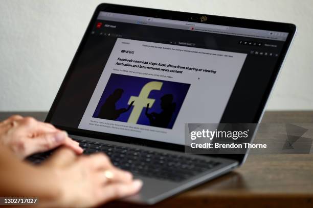 In this photo illustration ABC News reports on Facebook's news ban on Australian and International content on February 18, 2021 in Sydney, Australia....