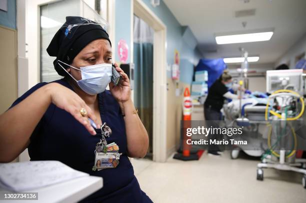 Senior chaplain Andrea Cammarota speaks with a patient's family in the Emergency Department at Providence Holy Cross Medical Center in the Mission...