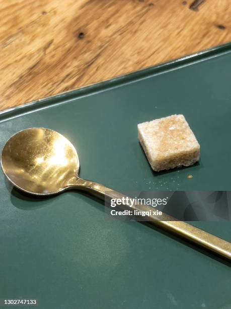 sugar cubes on the plate and spoon - sugar cubes in tea stock pictures, royalty-free photos & images