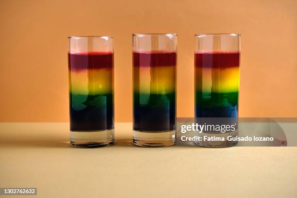 jelly glass with gay pride flag colored jellies - sicherheitsgitter stock-fotos und bilder