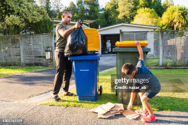 little helping hands. - mixed recycling bin stock pictures, royalty-free photos & images