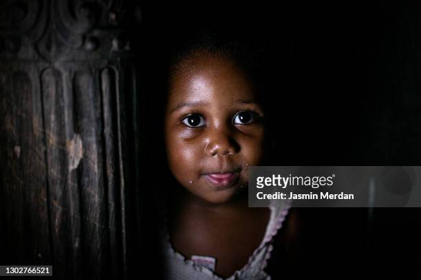 little cute african girl dark portrait - poor africans stock pictures, royalty-free photos & images