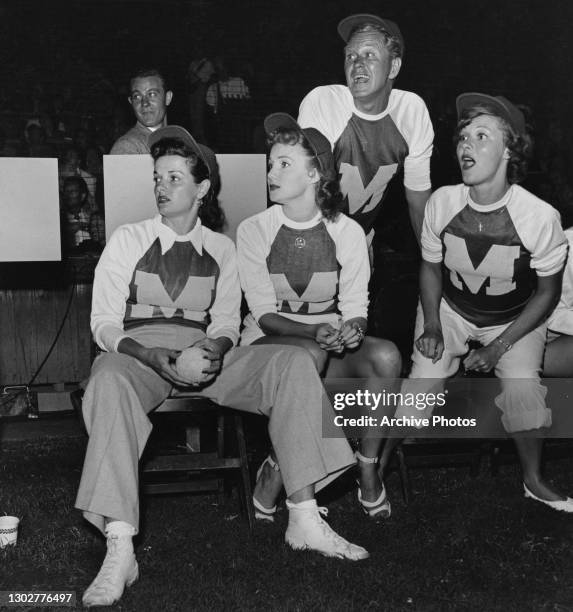 Actress Jane Russell and actress Rhonda Fleming watch the charity baseball match, US, circa 1948.
