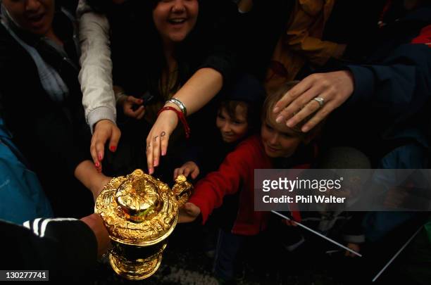Mils Muliaina of the All Blacks holds out the Webb Ellis Cup for the crowd during the New Zealand All Blacks 2011 IRB Rugby World Cup celebration...