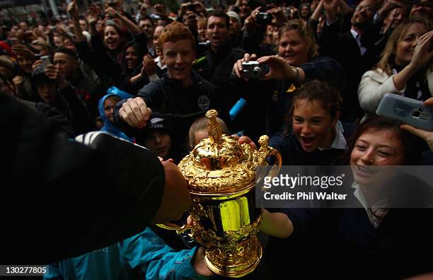 Mils Muliaina of the All Blacks holds out the Webb Ellis Cup for the crowd during the New Zealand All Blacks 2011 IRB Rugby World Cup celebration...