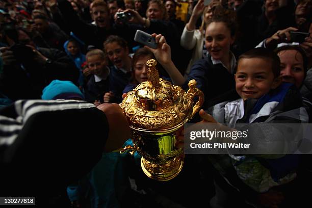 Mils Muliaina of the All Blacks holds out the Webb Ellis Cup for the crowd during the New Zealand All Blacks 2011 IRB Rugby World Cup celebration...