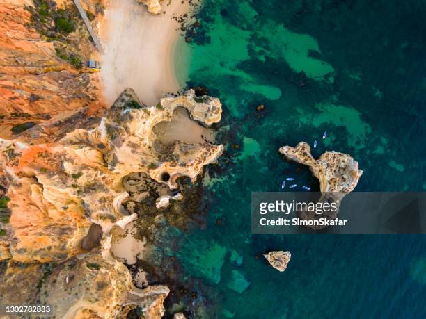 cliffs with rock formations at ponta da piedade - ponta da piedade stock pictures, royalty-free photos & images