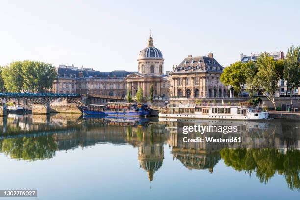 france, ile-de-france, paris, institut de france reflecting in river seine - musee dorsay stock pictures, royalty-free photos & images
