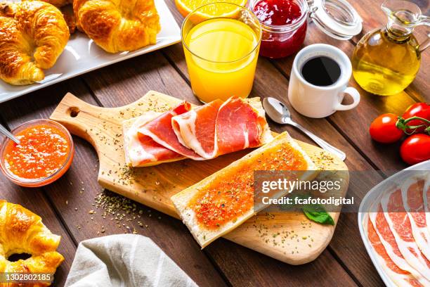 mediterranean breakfast on wooden table. high angle view - tostada stock pictures, royalty-free photos & images