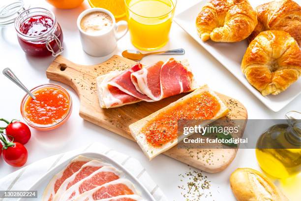 mediterranean breakfast on white table. high angle view - tostada stock pictures, royalty-free photos & images