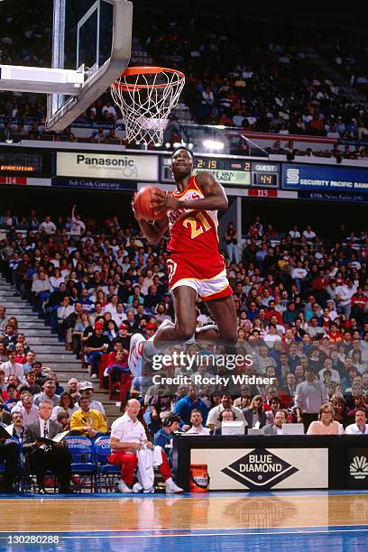 Dominique Wilkins of the Atlanta Hawks dunks against the Sacramento Kings on January 16, 1990 at Arco Arena in Sacramento, California. NOTE TO USER:...