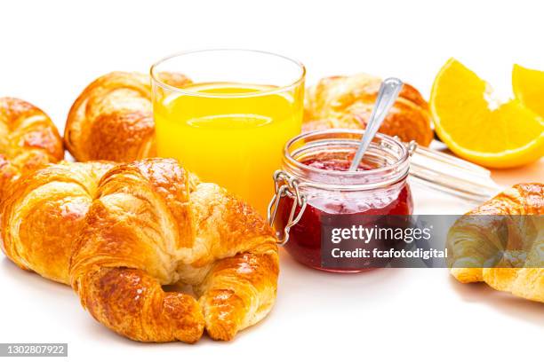 breakfast: croissants, orange juice and marmalade on white table - orange juice glass white background stock pictures, royalty-free photos & images