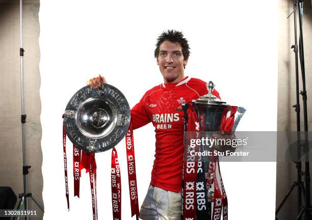Wales player James Hook celebrates with the Triple Crown and the 6 Nations Trophy after the RBS Six Nations Championship match between Wales and...