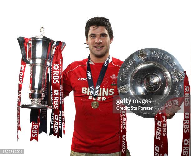 Wales player Mike Phillips celebrates with the Triple Crown and the 6 Nations Trophy after the RBS Six Nations Championship match between Wales and...