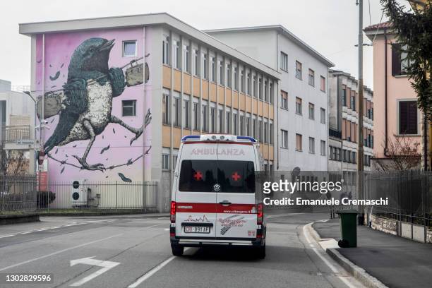 An ambulance of the Italian Red Cross is pictured driving in the streets on February 18, 2021 in Bergamo, Italy. The northern Italian province of...