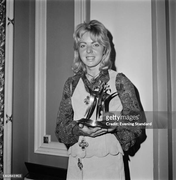 English equestrian Ann Moore with the Andrew and Booth Olympics Award for the Most Courageous British Performance, after she won a silver medal in...