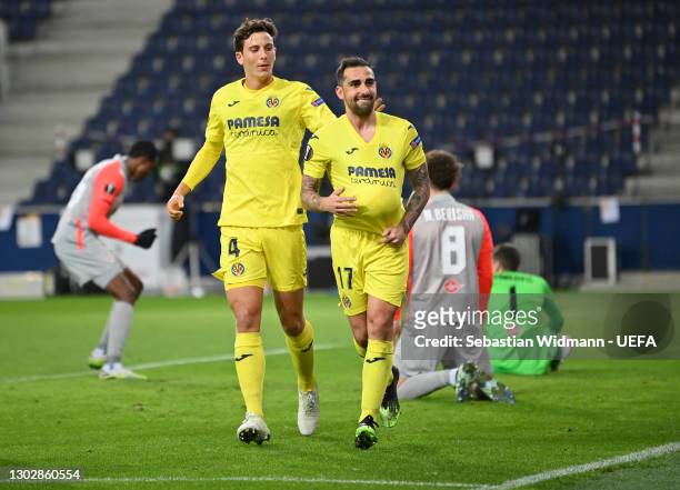 Paco Alcacer of Villarreal CF celebrates after scoring their sides first goal with team mate Pau Torres during the UEFA Europa League Round of 32...