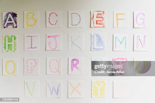 homemade alphabet on wall - alphabet hand made stock-fotos und bilder