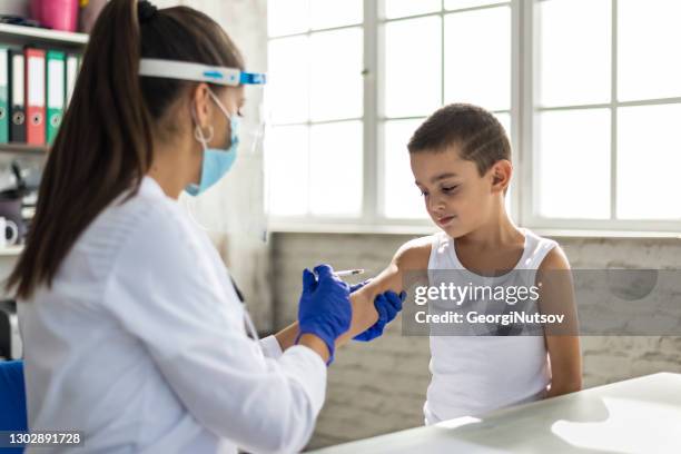 in the doctor's office of a pediatrician. - diphtheria stock pictures, royalty-free photos & images