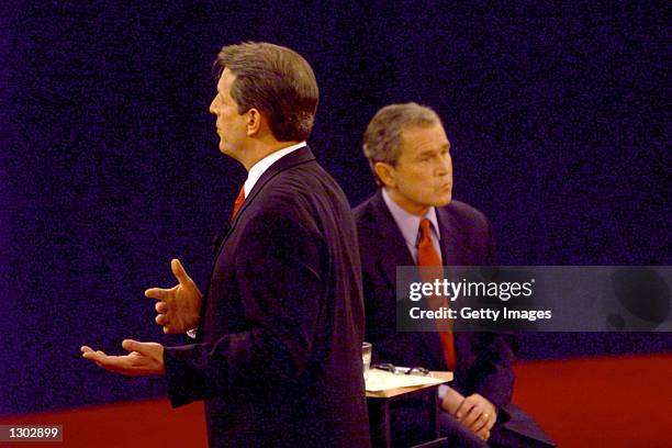 Democratic presidential candidate Vice President Al Gore, left, talks to the audience as his Republican opponent Texas governor George W. Bush, left,...