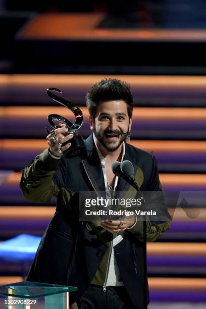 Camilo accepts the award for Pop Album of The Year onstage during Univision's 33rd Edition of Premio Lo Nuestro a la Música Latina at...