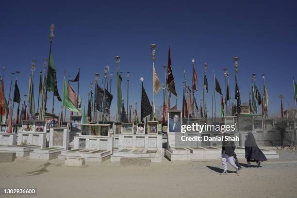 Family walks through the Hazara graveyard on February 05, 2021 in Quetta, Pakistan. Balochistan, a south-west region of Pakistan bordering...