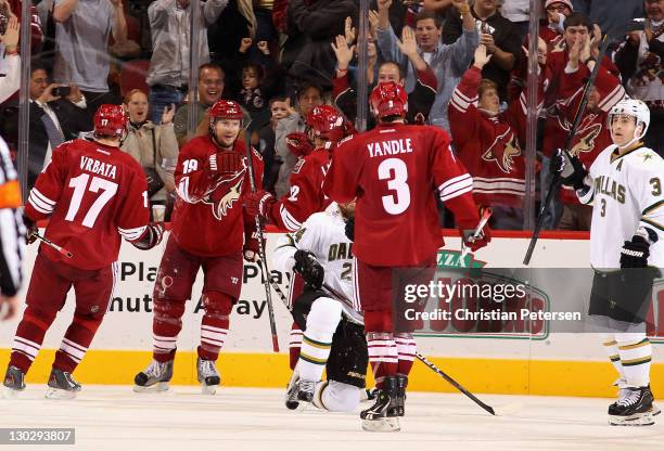 Shane Doan of the Phoenix Coyotes celebrates with teammates Radim Vrbata, Daymond Langkow and Keith Yandle after Doan scored a third period goal and...