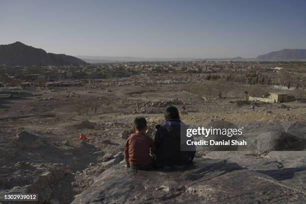 Hazara children play on a hill top at the Hazara neighborhood on February 14, 2021 in Quetta, Pakistan. Balochistan, a south-west region of Pakistan...