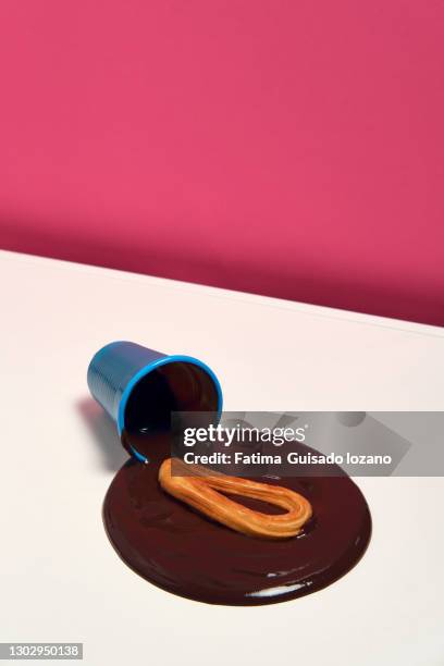 still life of churros with chocolate on a pink background - chocolate con churros stock pictures, royalty-free photos & images