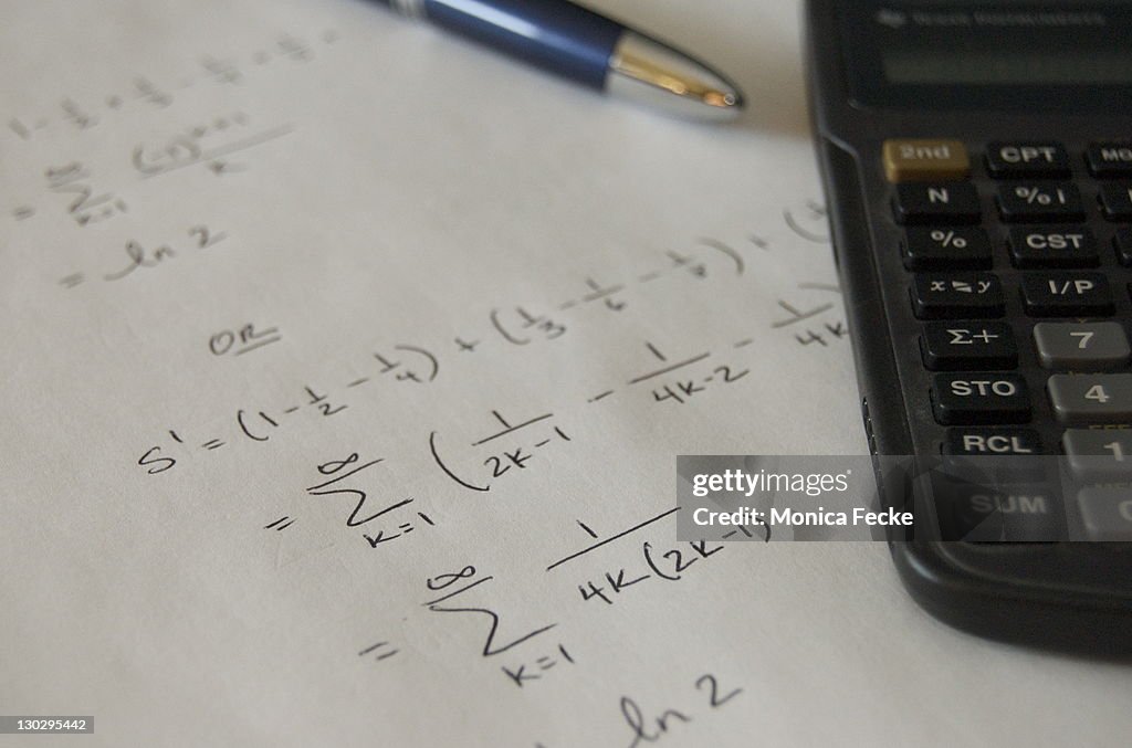 Computing Math With Pen Math Equation With Pen Paper And Calculator High-Res Stock Photo ...
