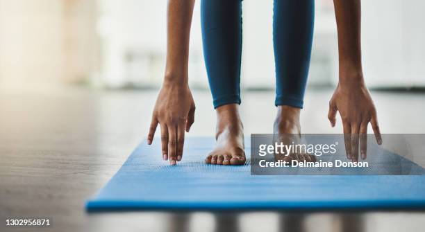 life gets tough but yoga says, "you've got this" - touching toes stock pictures, royalty-free photos & images
