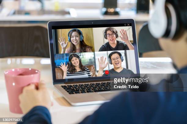 business persons talking on video conference - four people stock pictures, royalty-free photos & images
