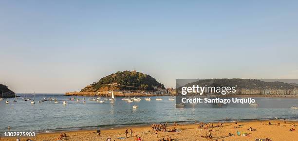 people relaxing at la concha beach - bay of biscay stock pictures, royalty-free photos & images