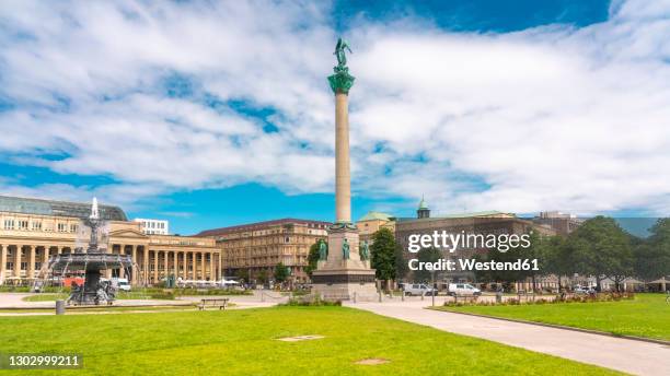 germany, baden-wurttemberg, stuttgart, clouds over schlossplatz with jubilaumssaule in foreground - stuttgart fotografías e imágenes de stock