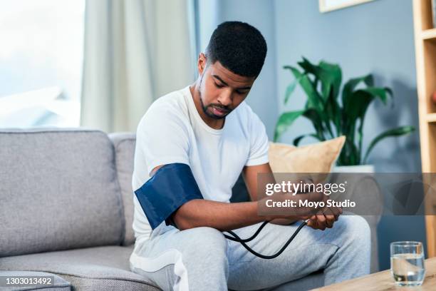 taking note of all his vitals - hypertensive stock pictures, royalty-free photos & images