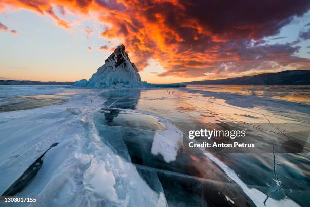 sunset on lake baikal in winter near elenka island - baikal stockfoto's en -beelden